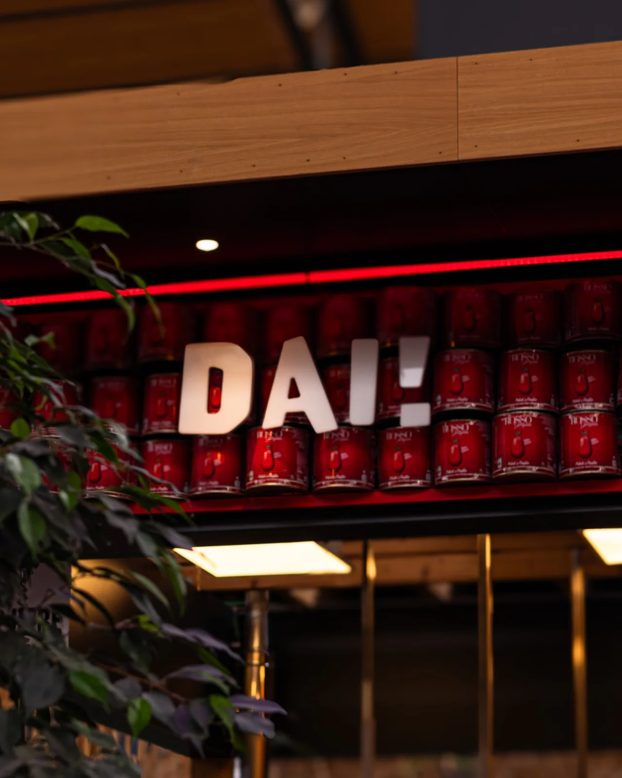 DAI Pizzeria stand and illuminated brand sign